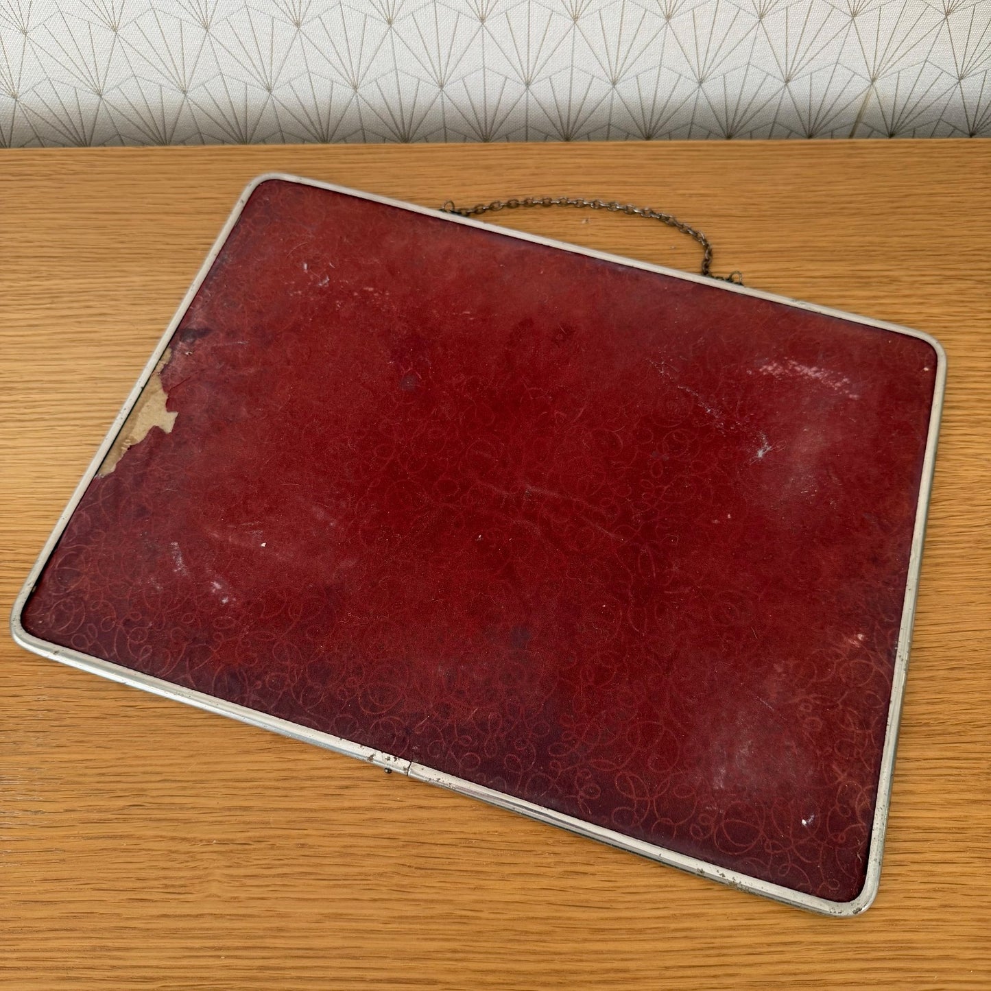 Reverse side showing red velvet backing and chrome metal frame of French vintage mirror