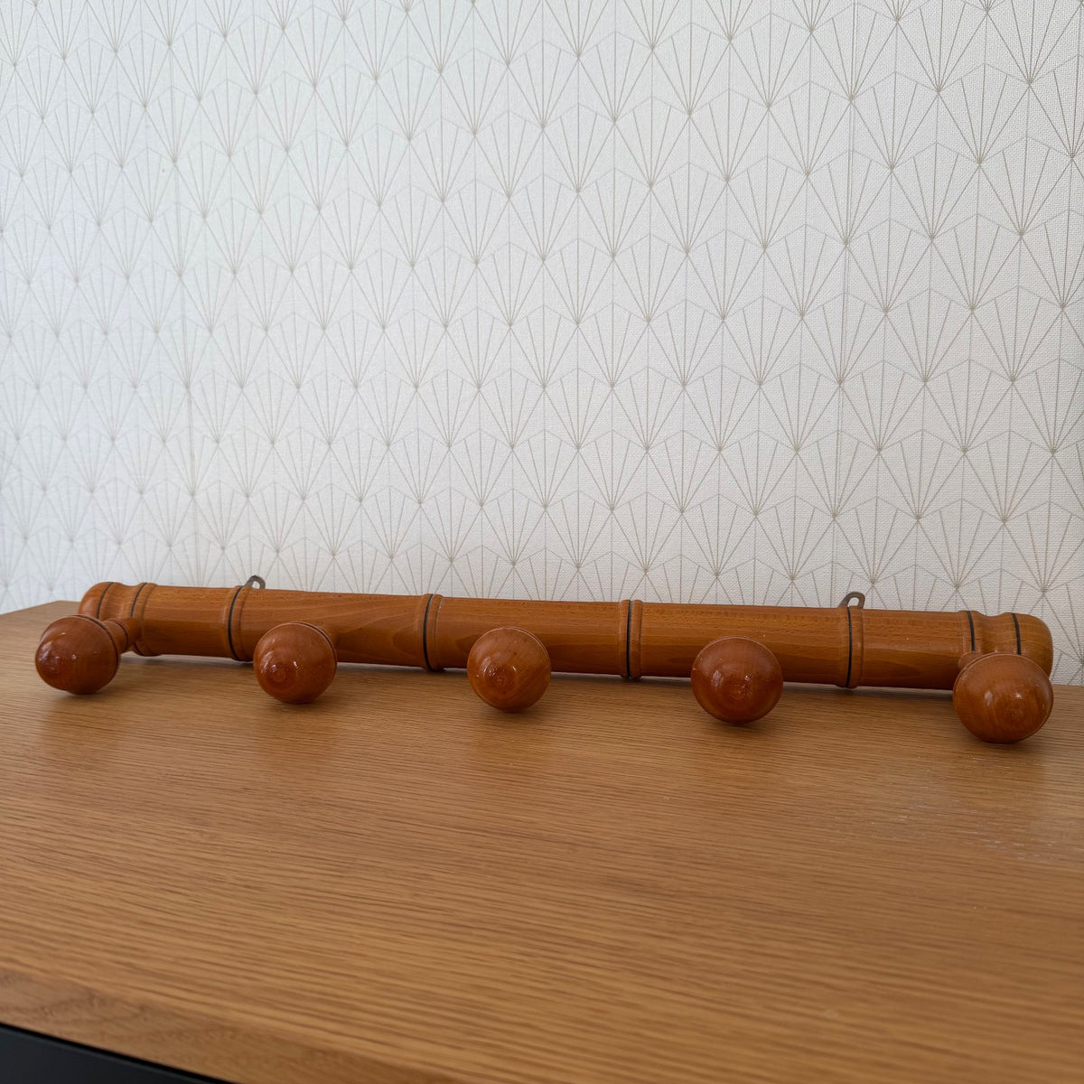 Detail of turned bamboo-style jointing on French vintage coat rack rail