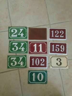 Vintage French enamel house number plaques with white numerals on green burgundy and cream backgrounds, heavy gauge enameled steel, sourced from France