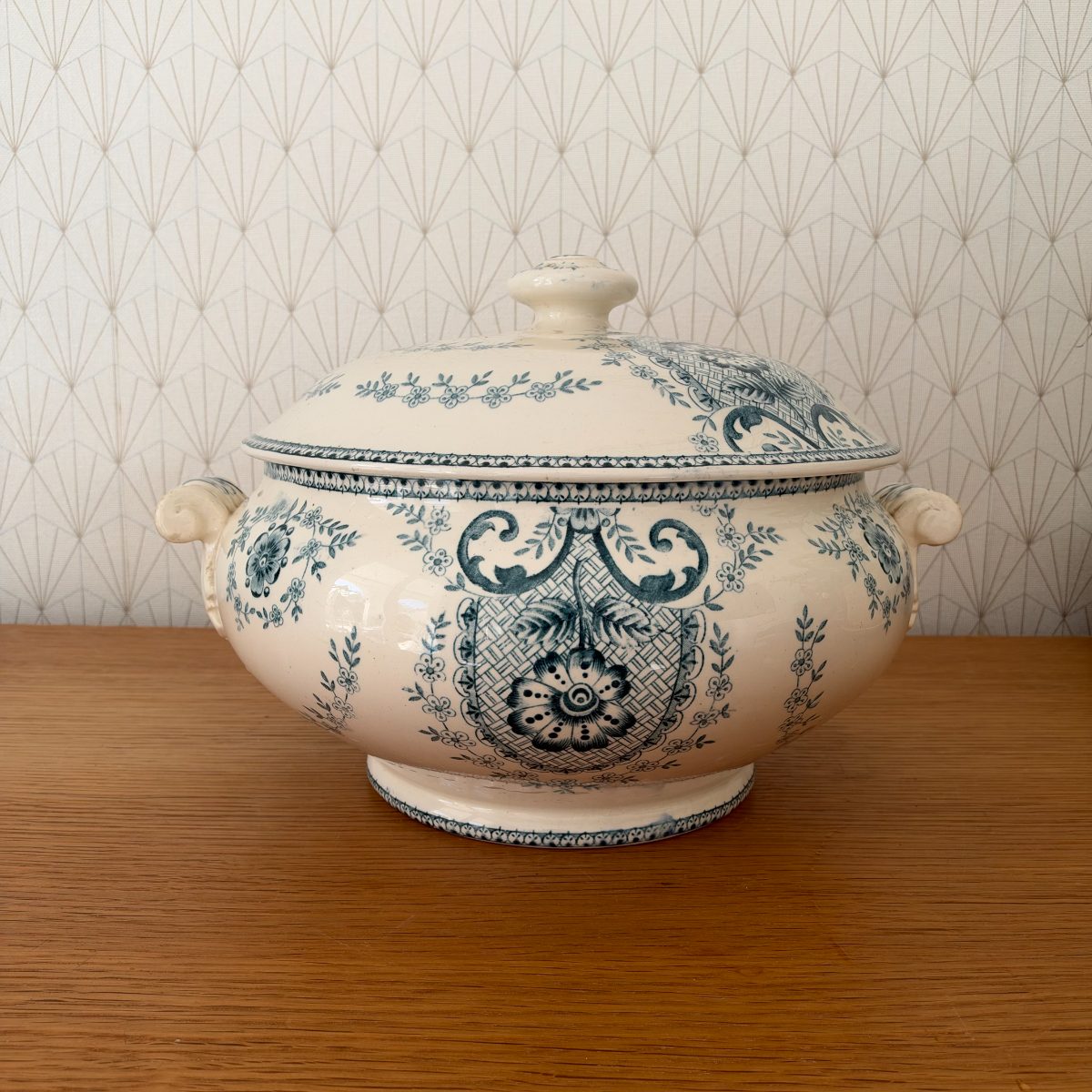 Antique French blue white transferware faience soup tureen without lid, front view showing full floral medallion and acanthus scroll decoration.