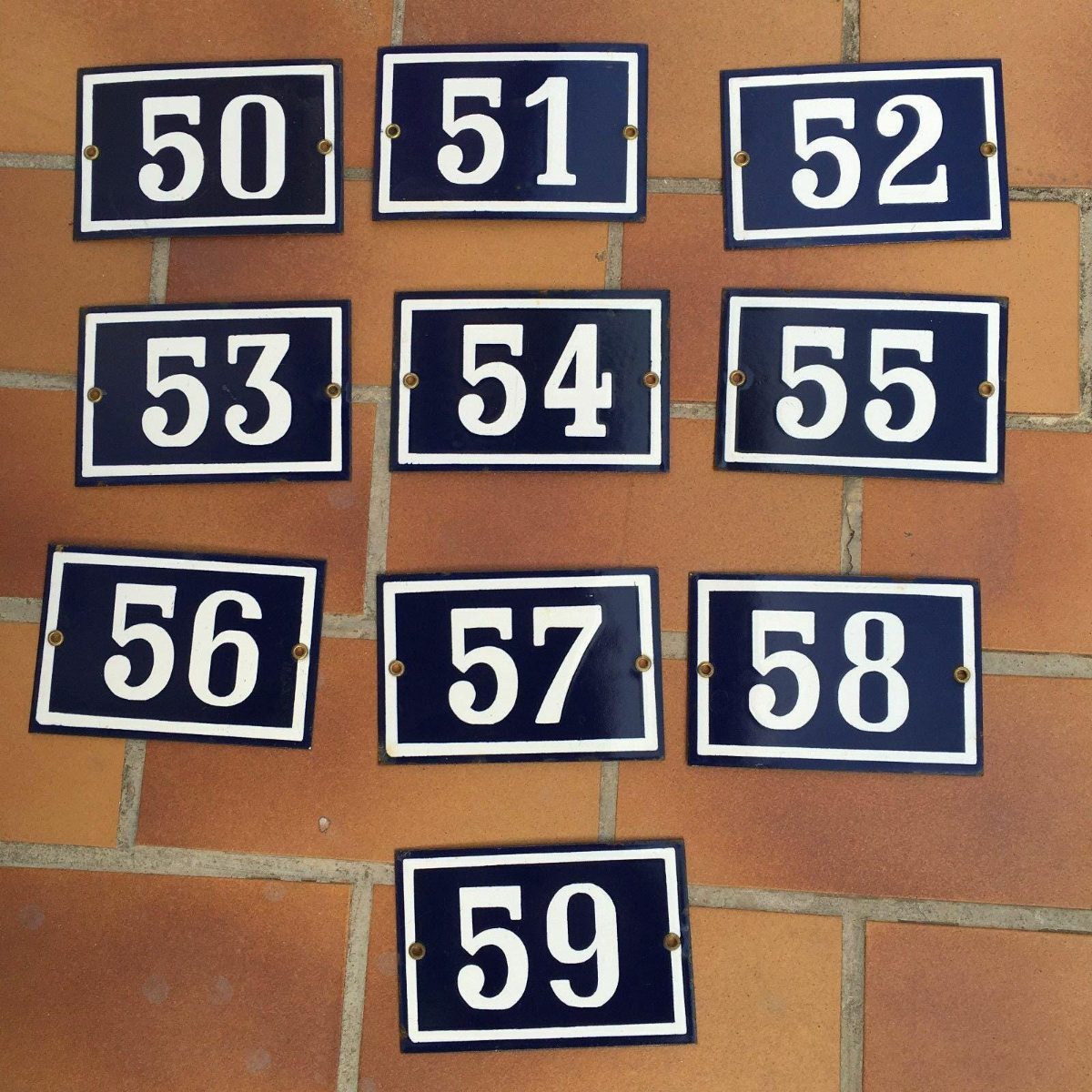Vintage French municipal street door number sign navy blue white border enameled steel construction showing authentic wear from original Parisian use