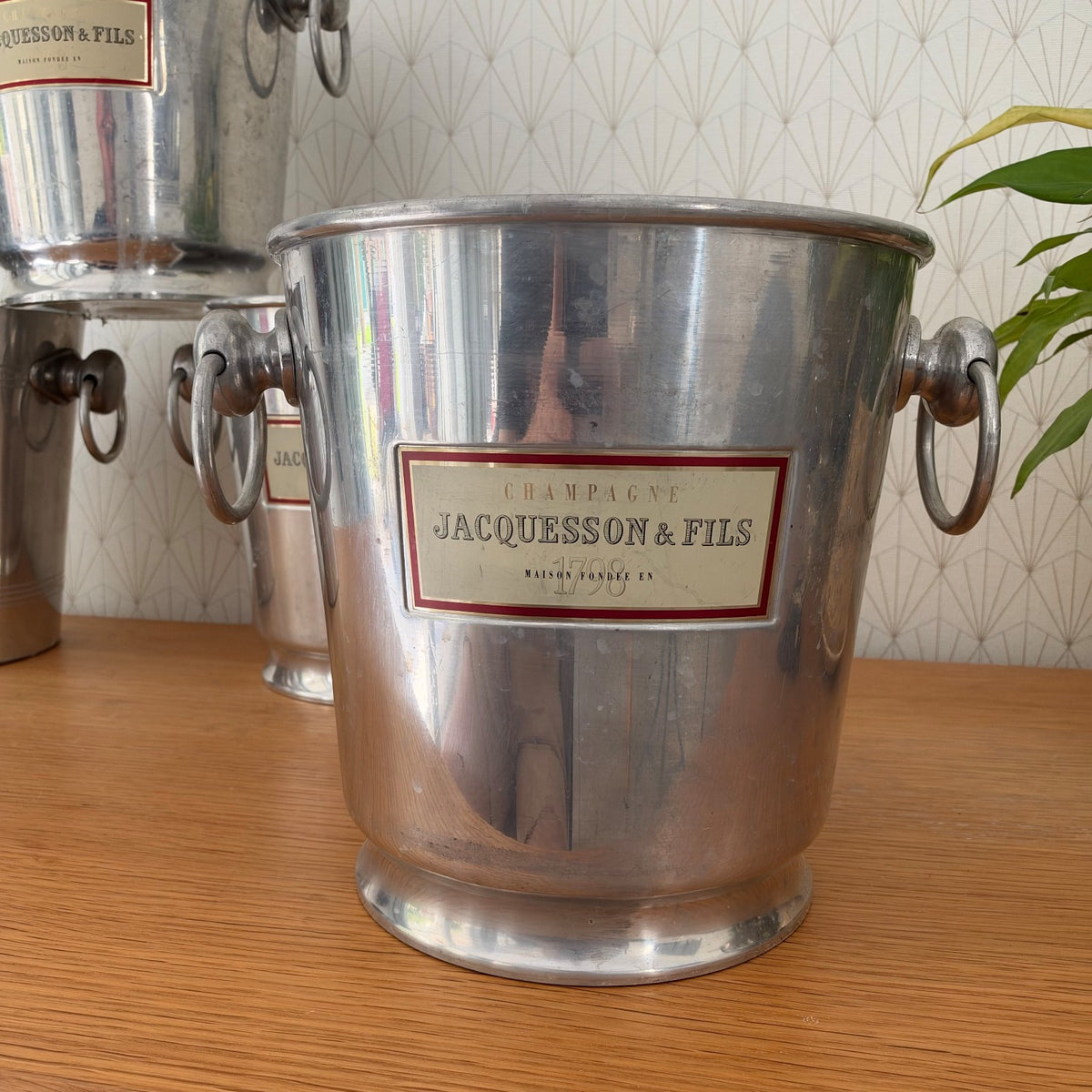 Close-up of Jacquesson Champagne ice bucket label showing Maison Fondee en 1798 on polished aluminum