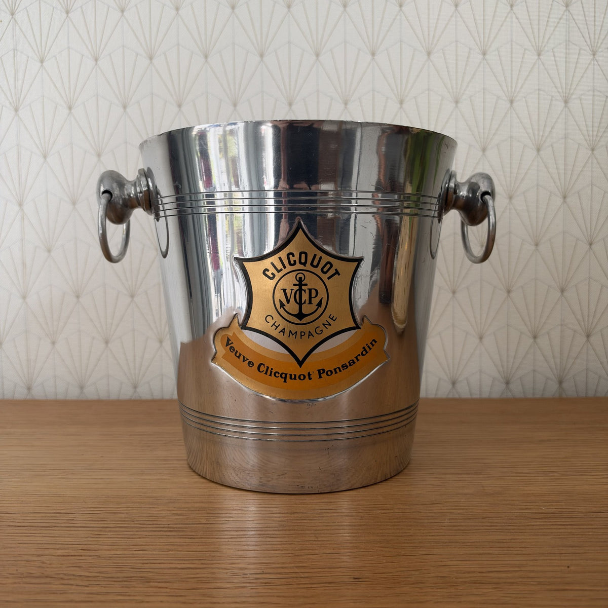 Vintage Veuve Clicquot Ponsardin champagne ice bucket with polished aluminum body and original amber label