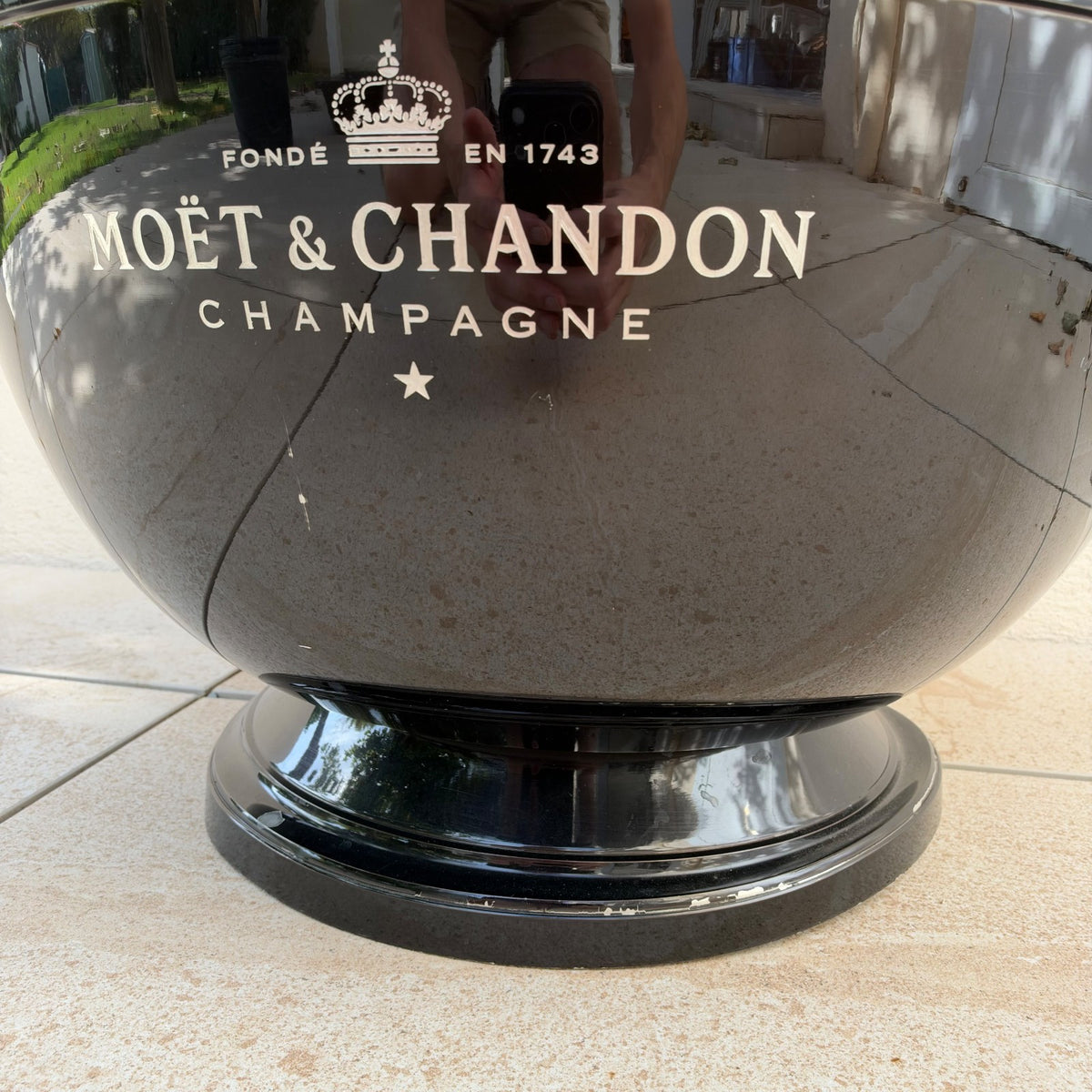 Front angle of large black Moet Chandon champagne bucket with founding date 1743