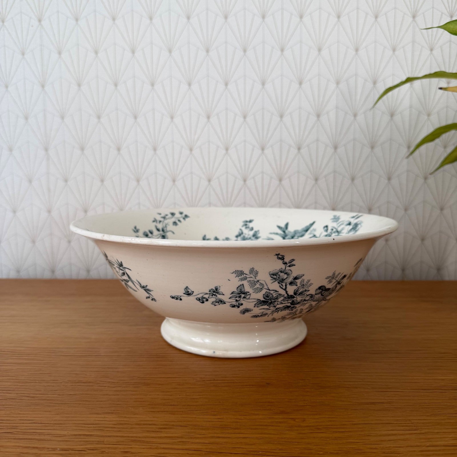Antique French Longwy pottery footed bowl with blue floral transfer-printed decoration, front view