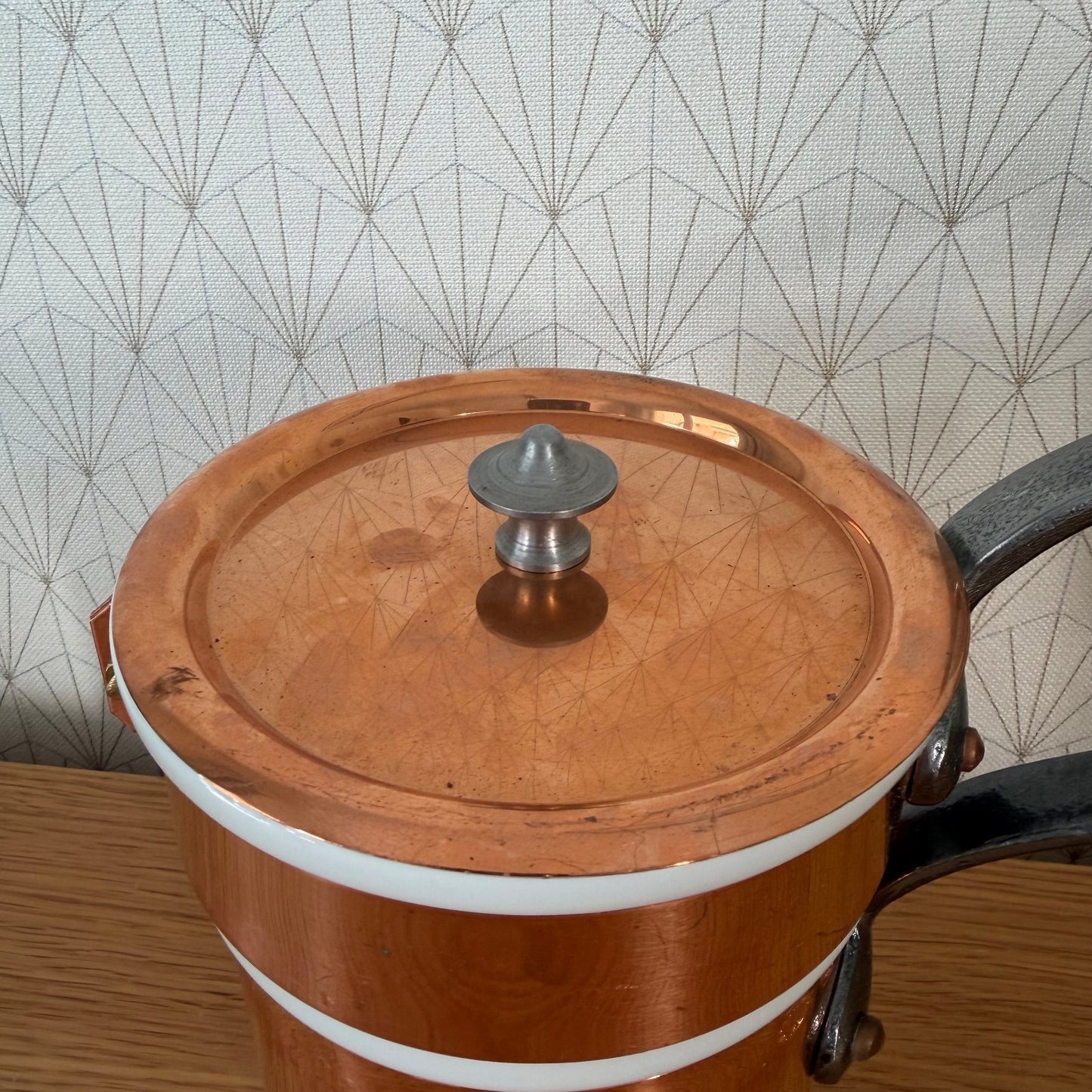 Copper bain marie saucepan with removable porcelain insert, top view with lid