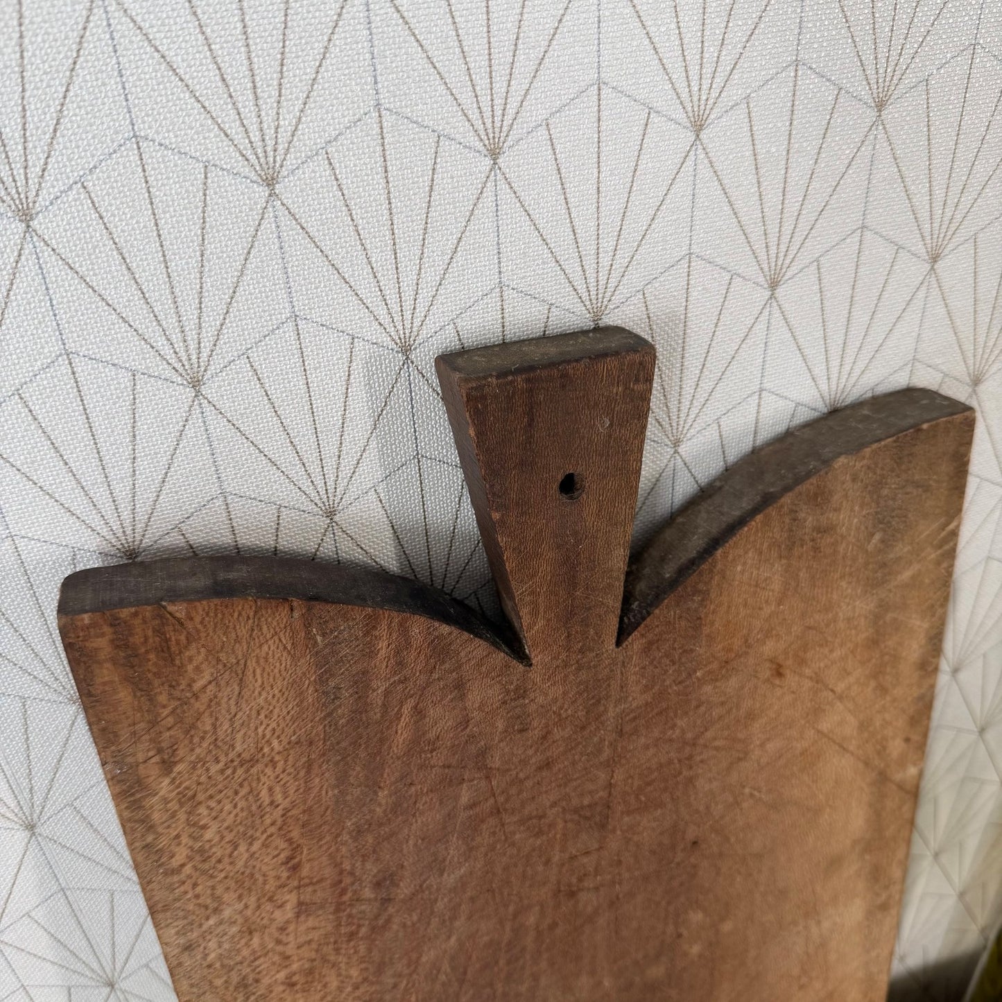 Rustic hardwood French antique bread board showing patina and wear from centuries of use