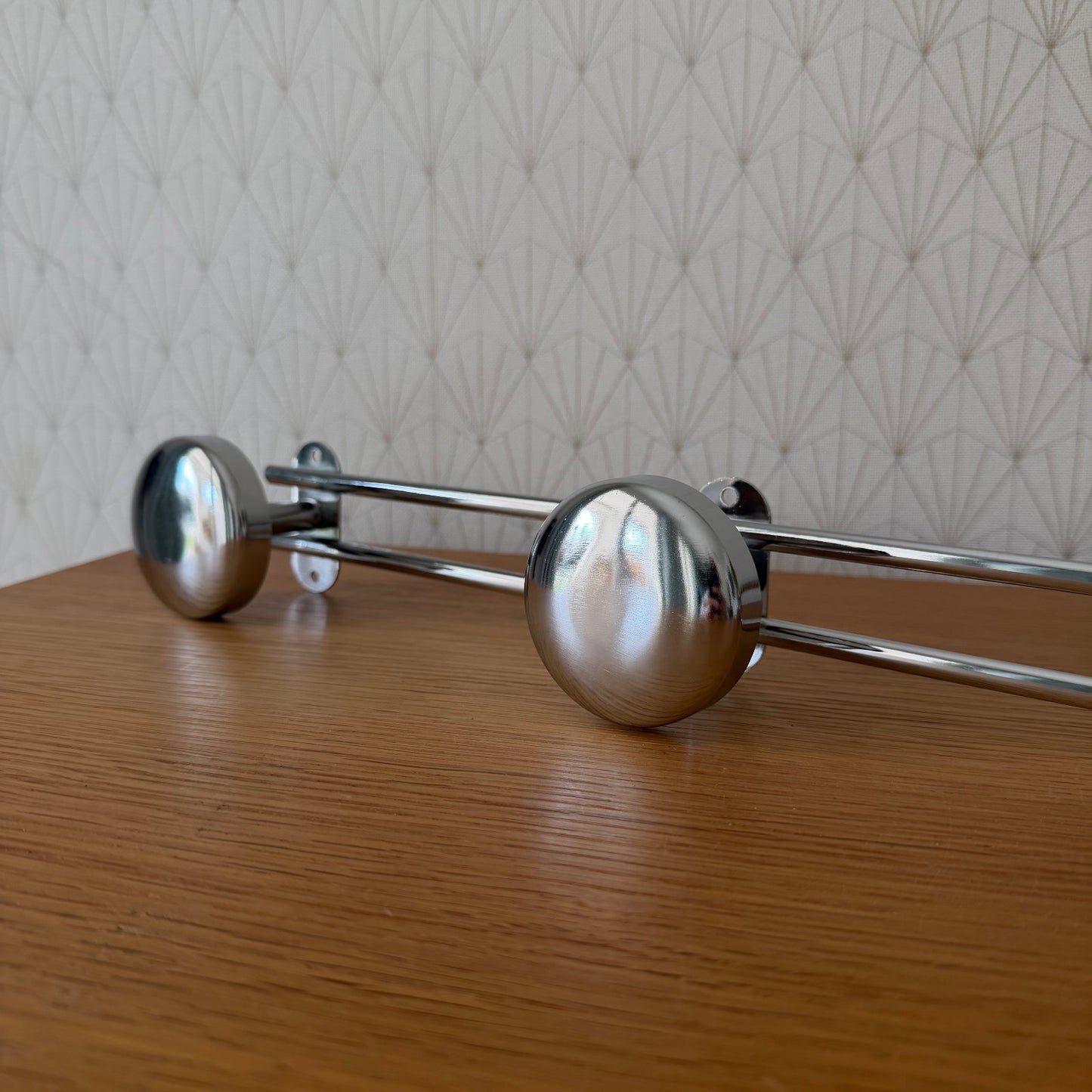 Front view of vintage French mid-century chrome coat hooks rack in deadstock condition