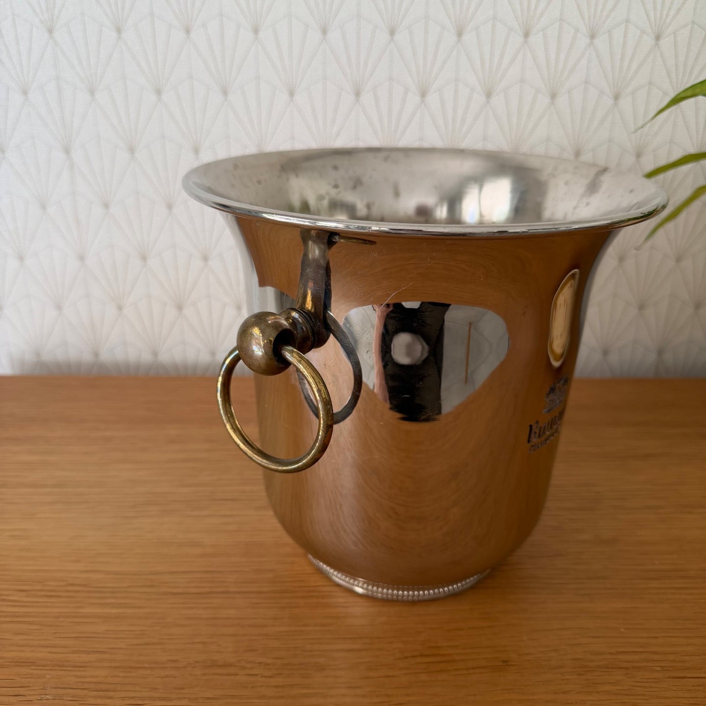 Side angle view showing brass ring handles and tapered chrome design