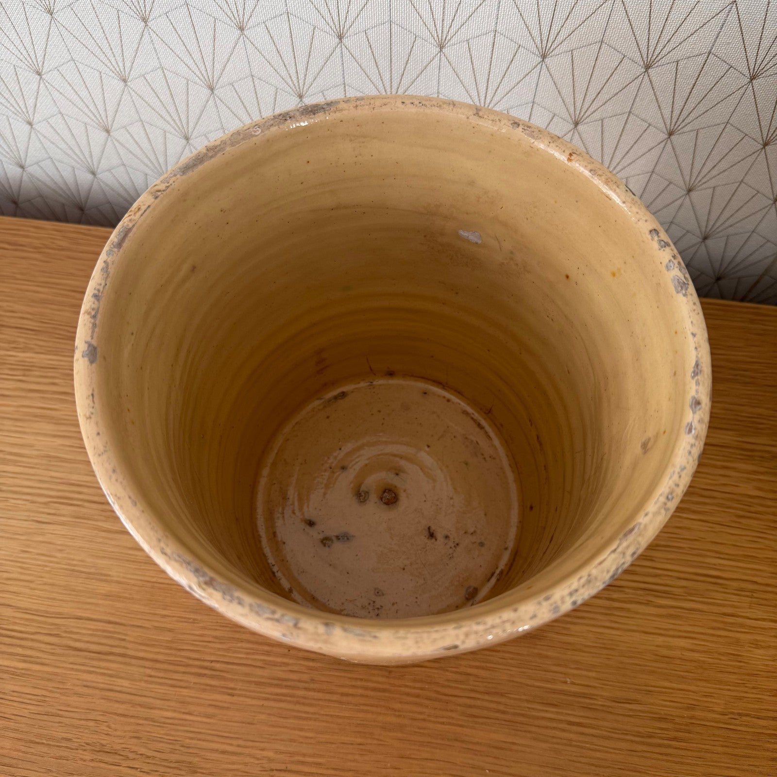 Antique French stoneware crock with curved handles and ochre coloring