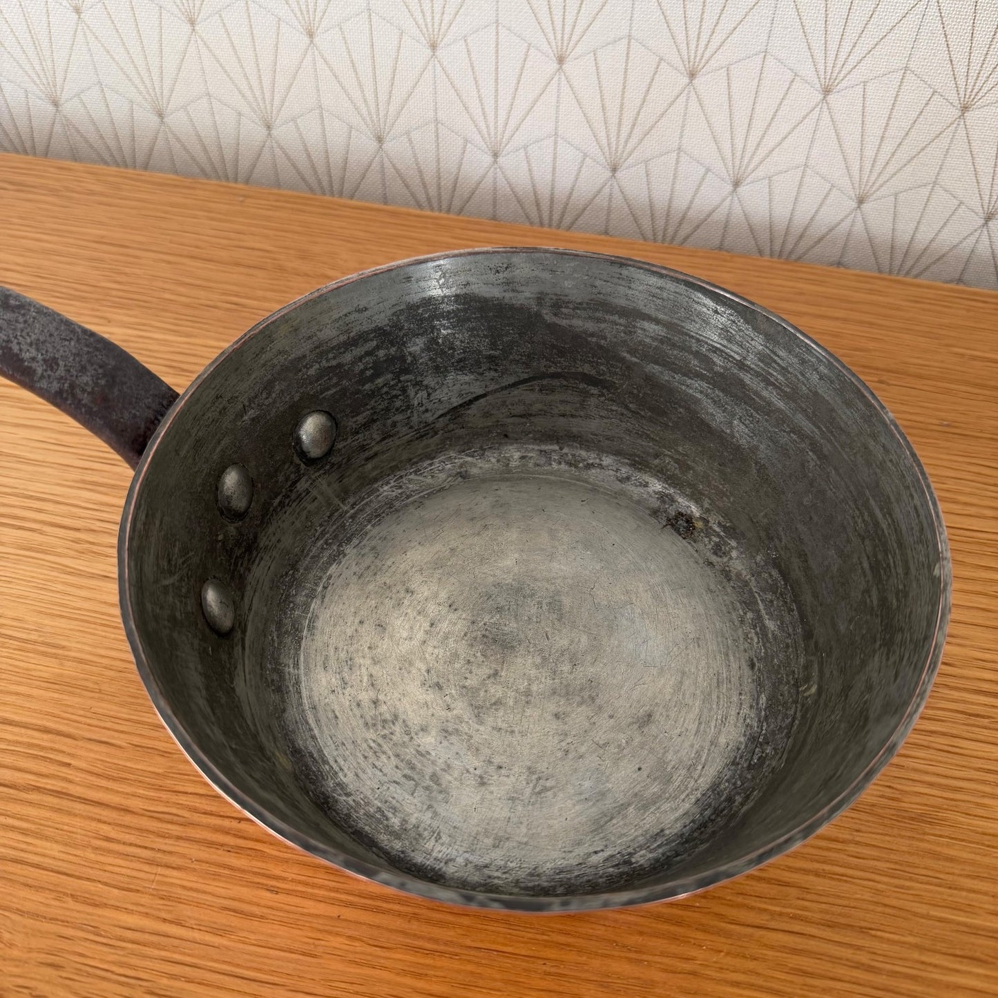 Overhead view showing tin-lined cooking surface and interior patina