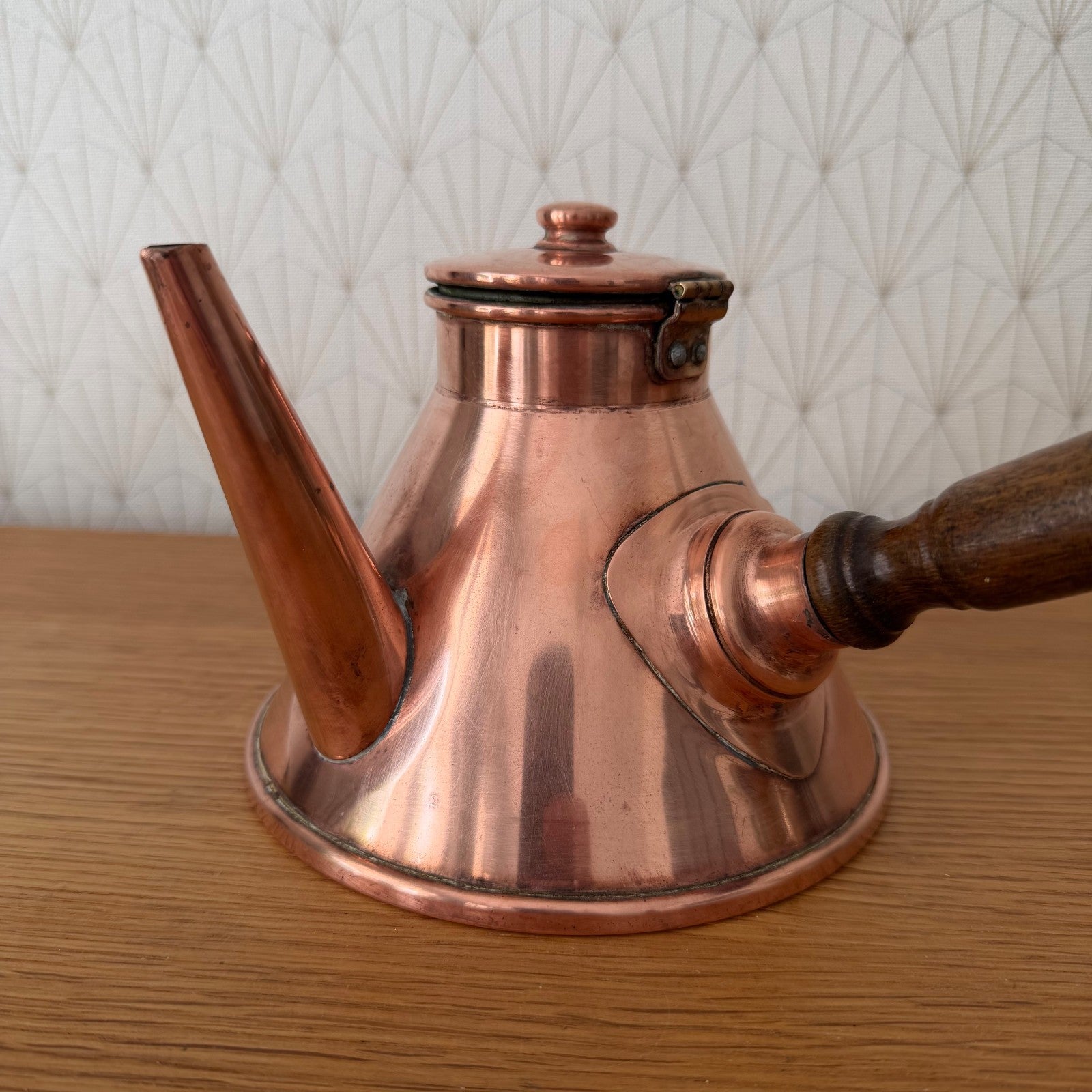 Vintage French chocolate pot from Villedieu, angled view with handle extended
