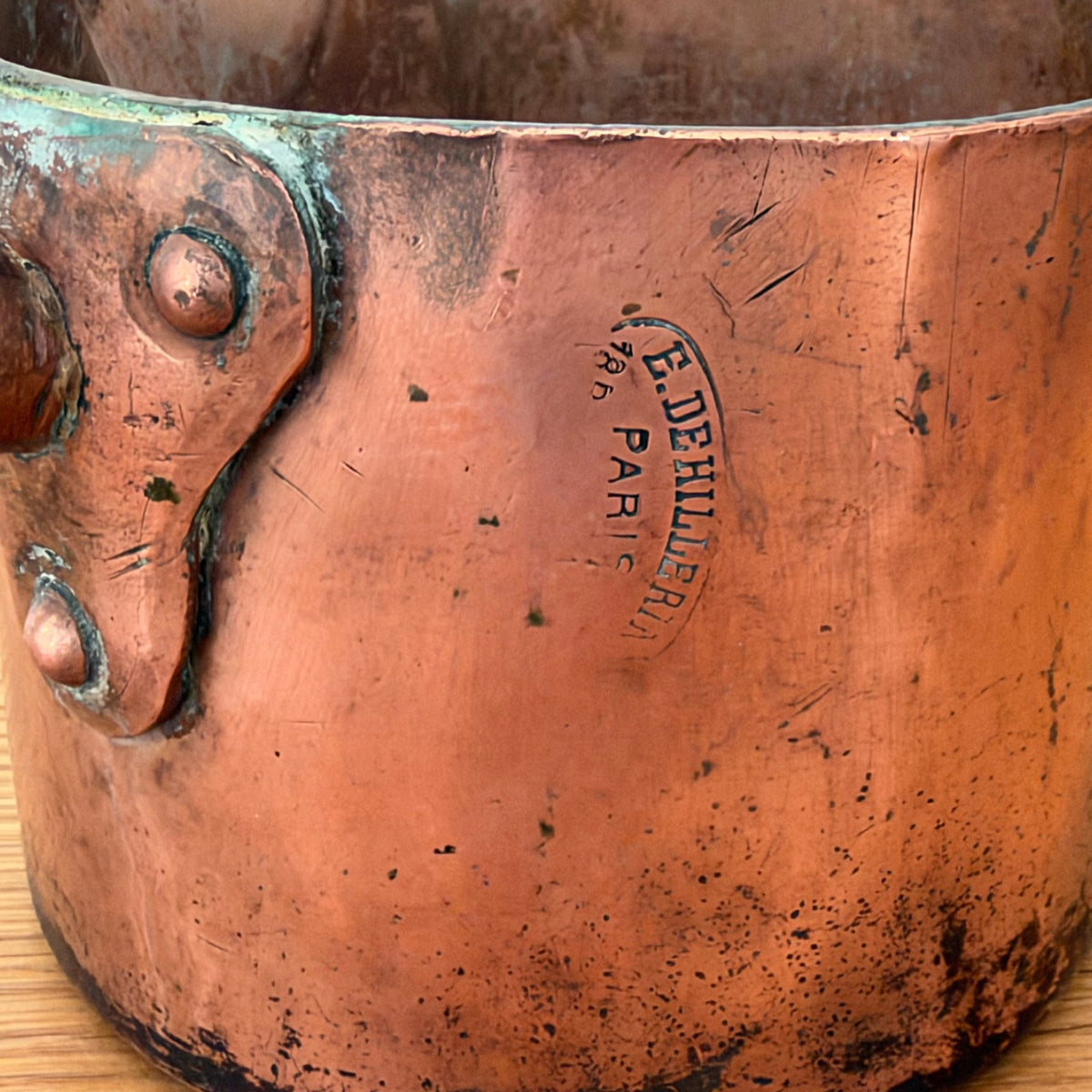 Interior of antique French Dehillerin copper sugar pan showing deep patina and use