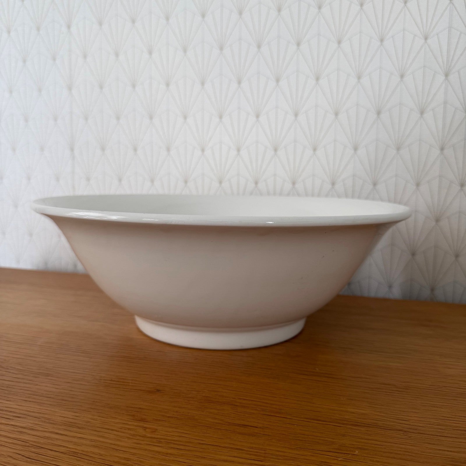 Wide profile of vintage French ceramic fruit bowl showing flared rim and foot ring