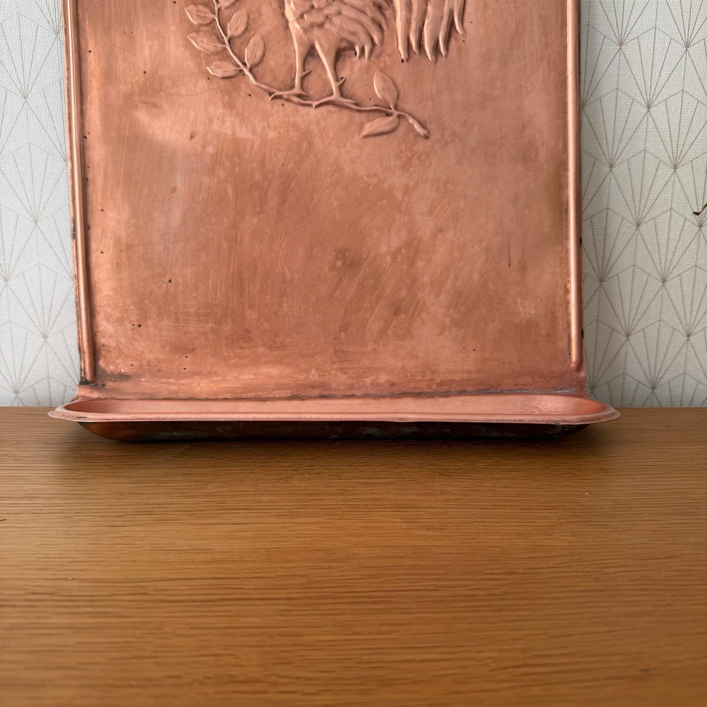 Back view of vintage French copper hanger showing wall mounting and base shelf