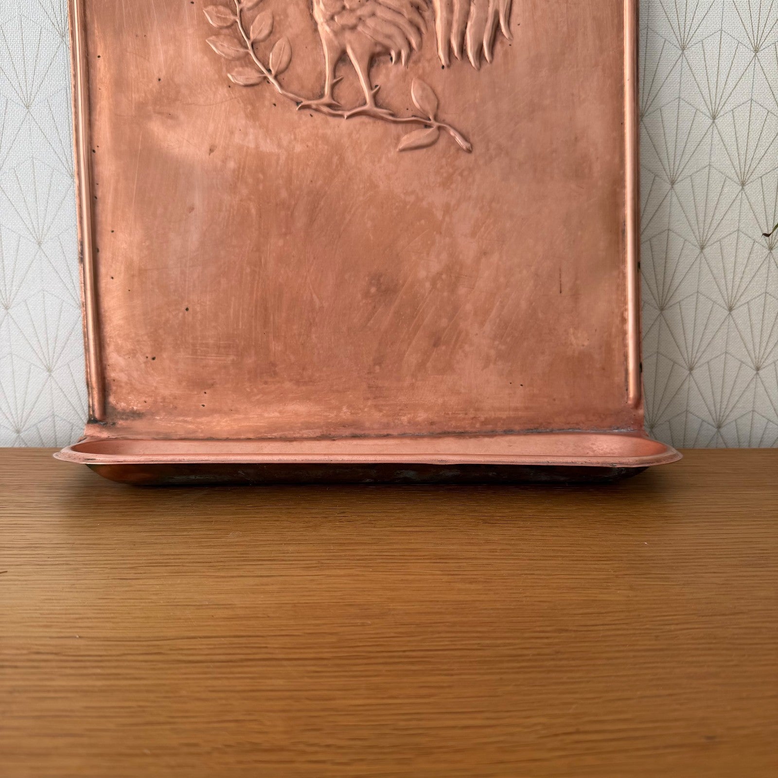 Back view of vintage French copper hanger showing wall mounting and base shelf