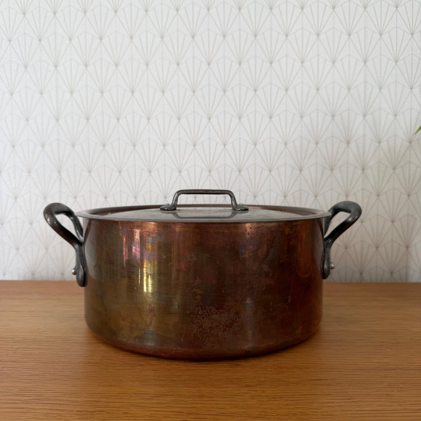 Vintage French copper cocotte with cast iron loop handles, front view