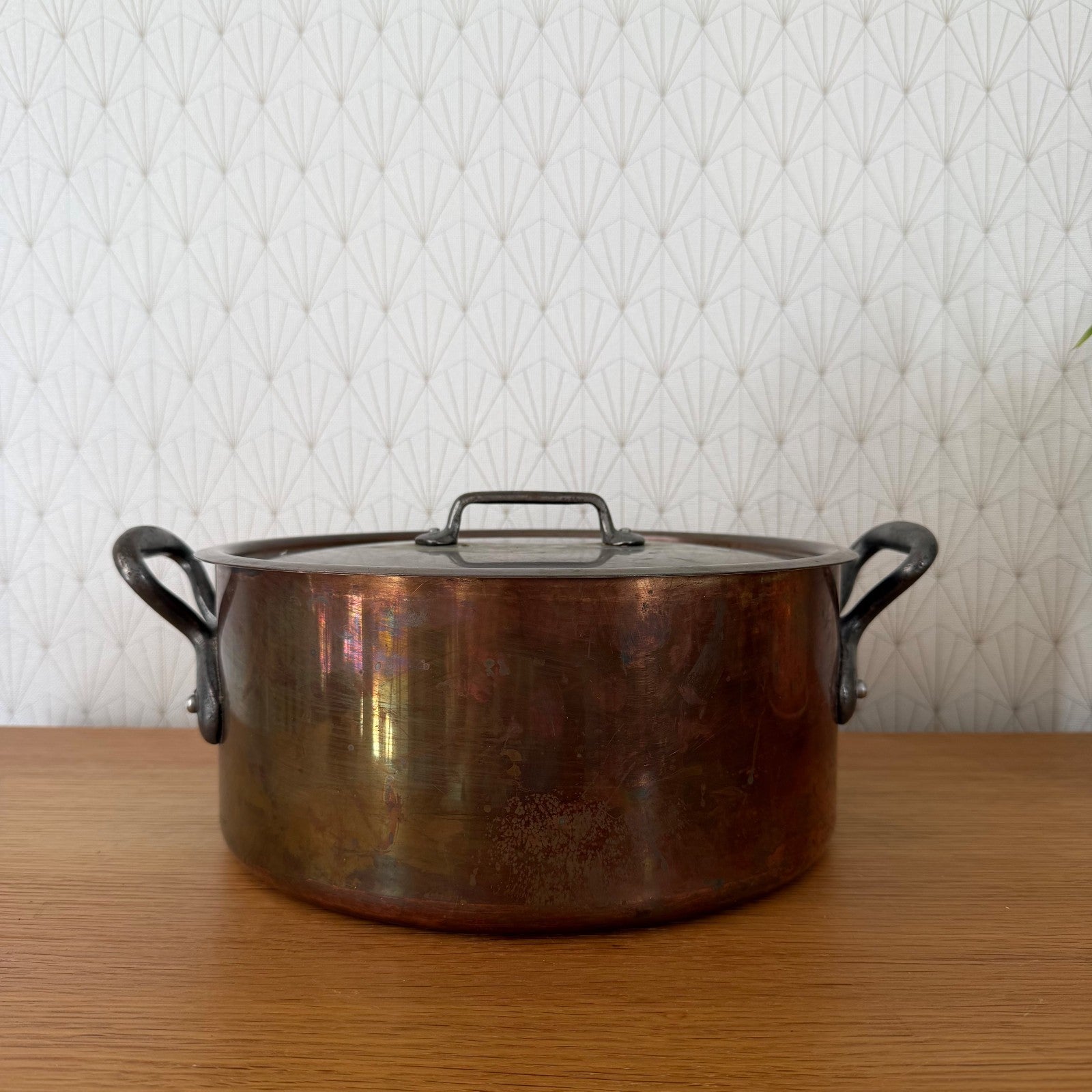 Vintage French copper cocotte with cast iron loop handles, front view