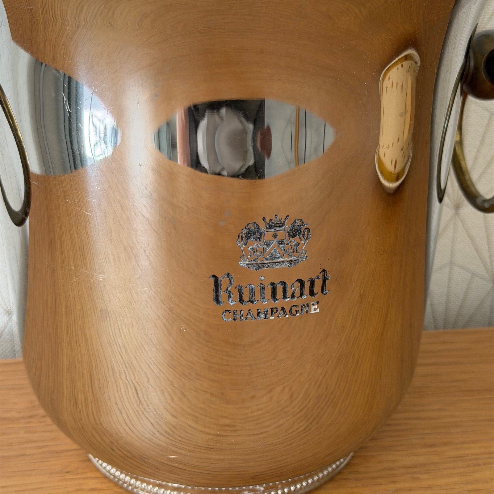 Close-up of Ruinart logo and engraving on champagne ice bucket exterior