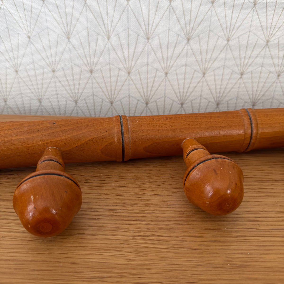 French bamboo-style coat rack showing turned acorn knobs and lacquered finish