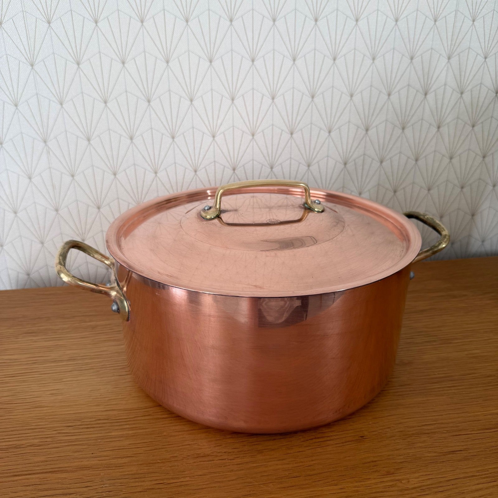 Copper stockpot lid with brass handle and Cuivralec maker's mark stamped inside