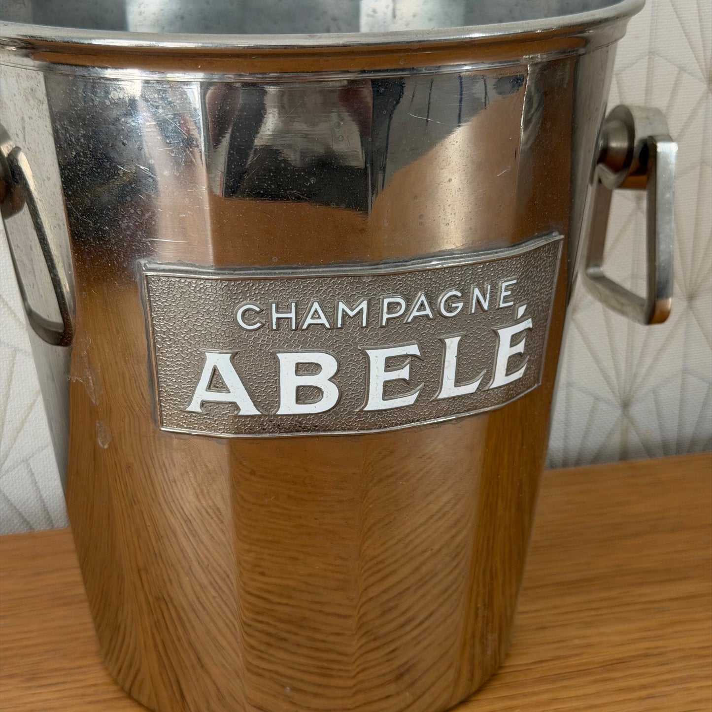 Close-up of ABELE metal nameplate on champagne ice bucket