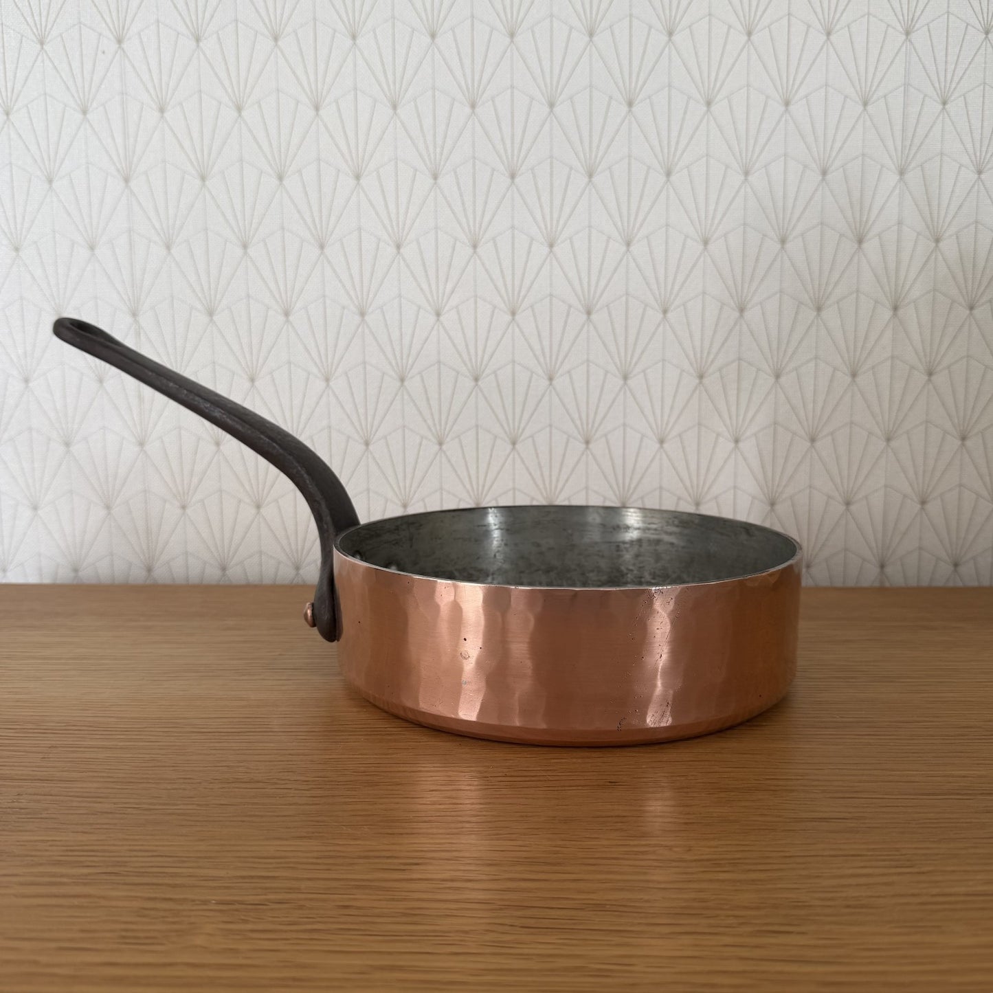Gaillard Paris copper saute pan with curved iron handle, exterior view showing polished copper body