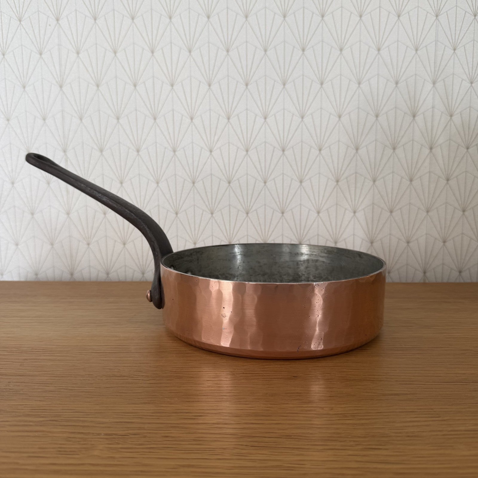 Gaillard Paris copper saute pan with curved iron handle, exterior view showing polished copper body