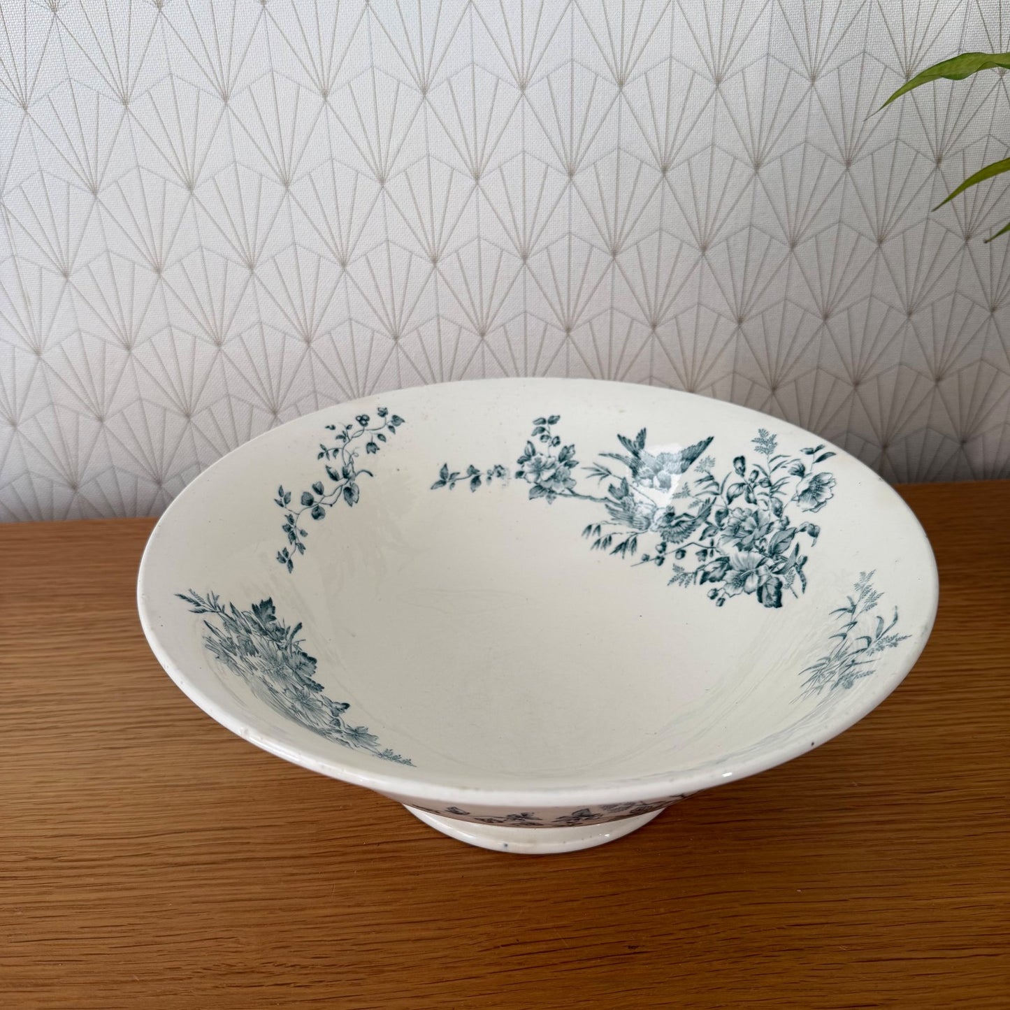 Antique French Longwy pottery footed bowl detail showing blue transfer-printed flowers across white glazed surface
