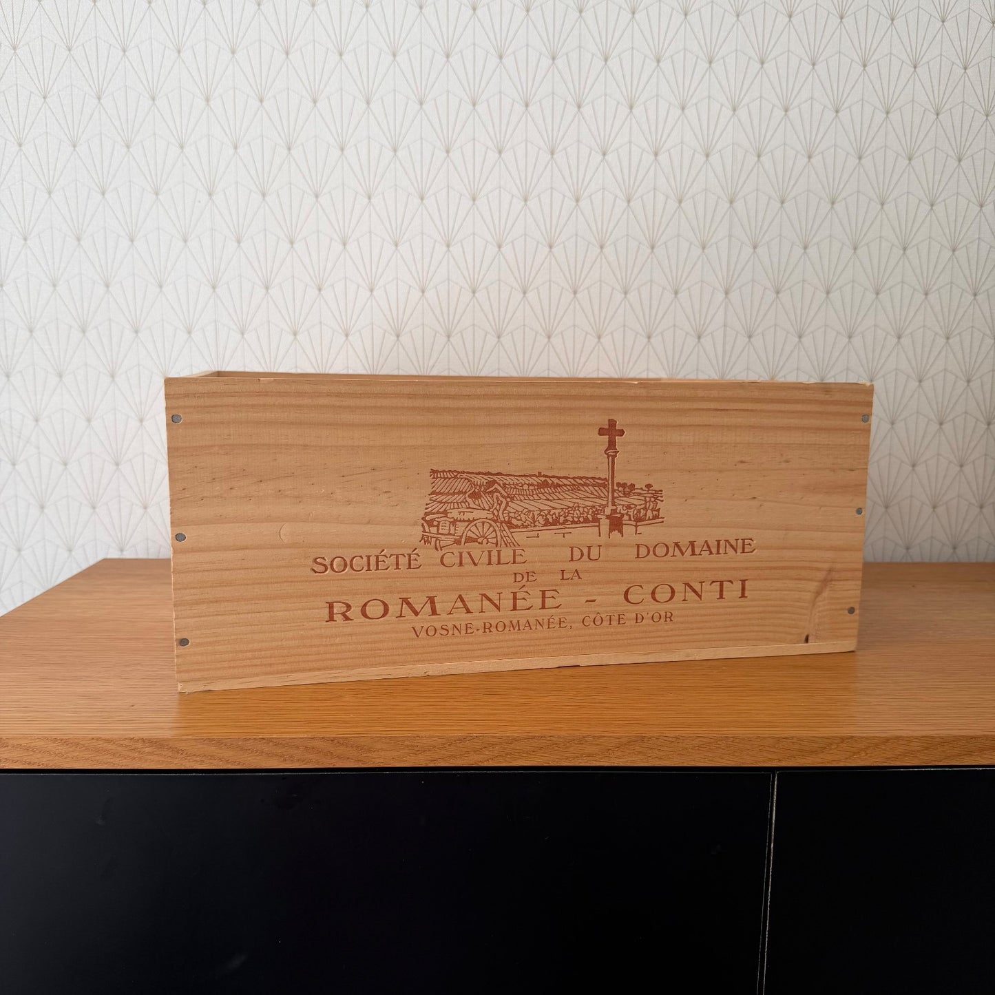 Vintage French wine crate panel with engraved Romanée-Conti domain branding and château illustration