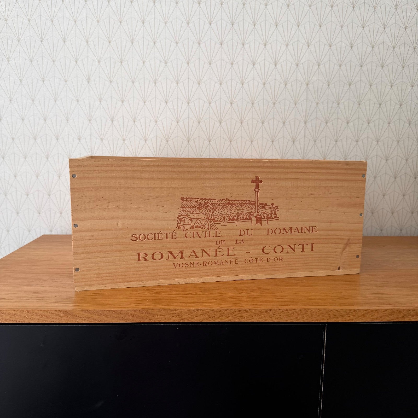 Vintage French wine crate panel with engraved Romanée-Conti domain branding and château illustration