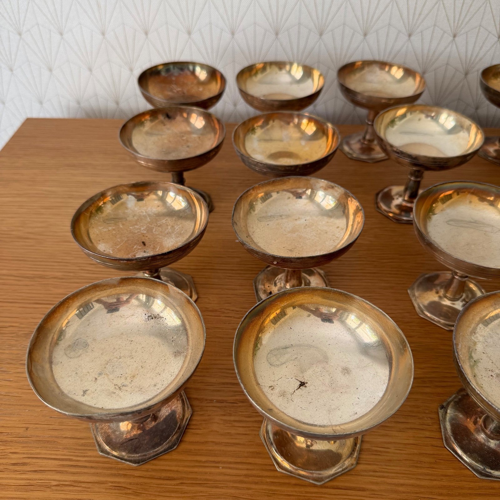 Detail of vintage silverplate champagne coupe bowl showing warm copper undertones and aged finish typical of early 20th century