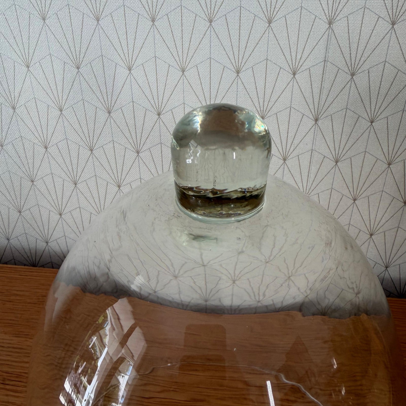 Hand-blown French glass cloche dome showing interior glass knob detail