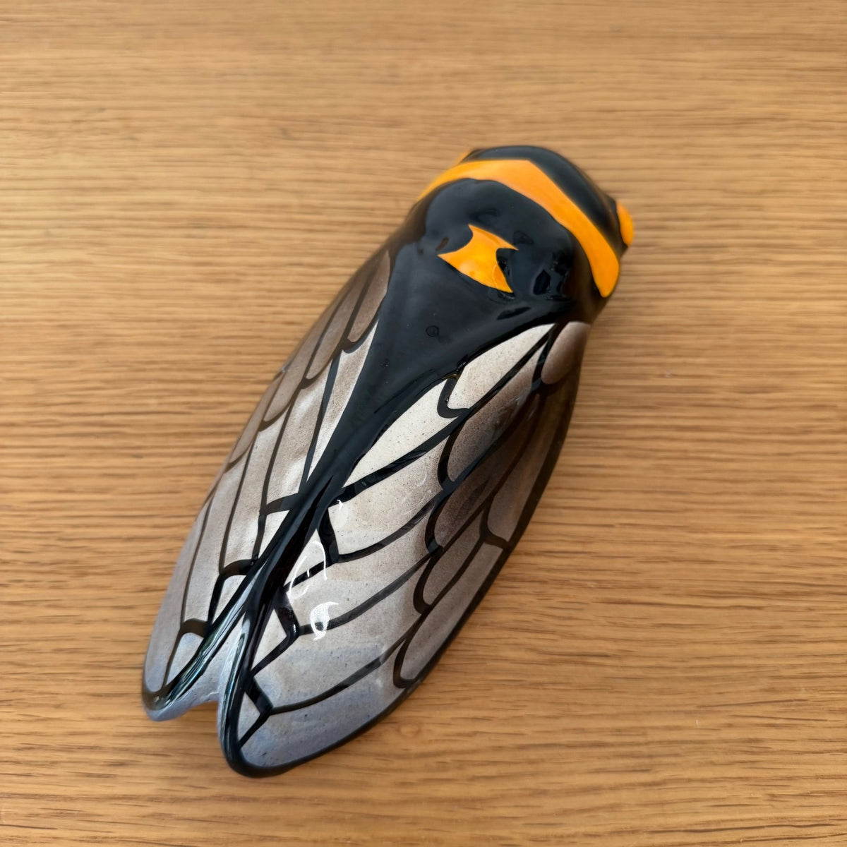 French majolica cicada wall pocket vase with black glaze and amber stripe detail