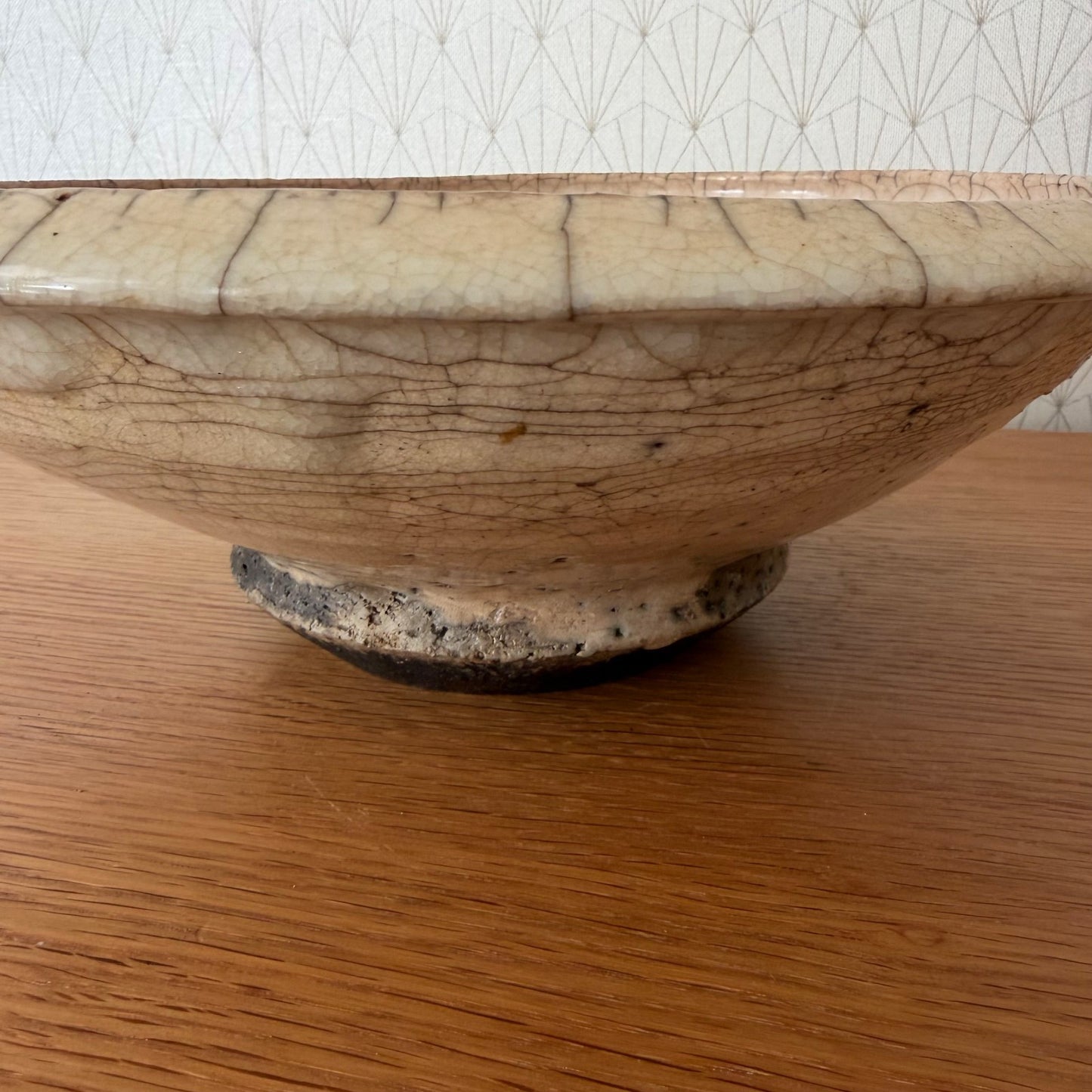 Bottom view of antique French pottery bowl showing footed base and maker's marks from 19th-century French production