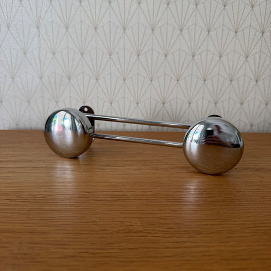 Vintage French chrome double door knob with spherical knobs and parallel connecting rods, side view