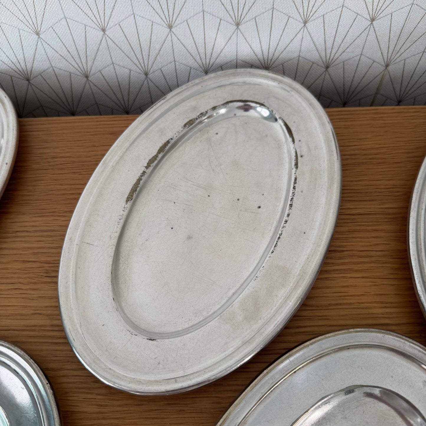 Two French silver plated oval serving trays displaying functional mid-century design and patina
