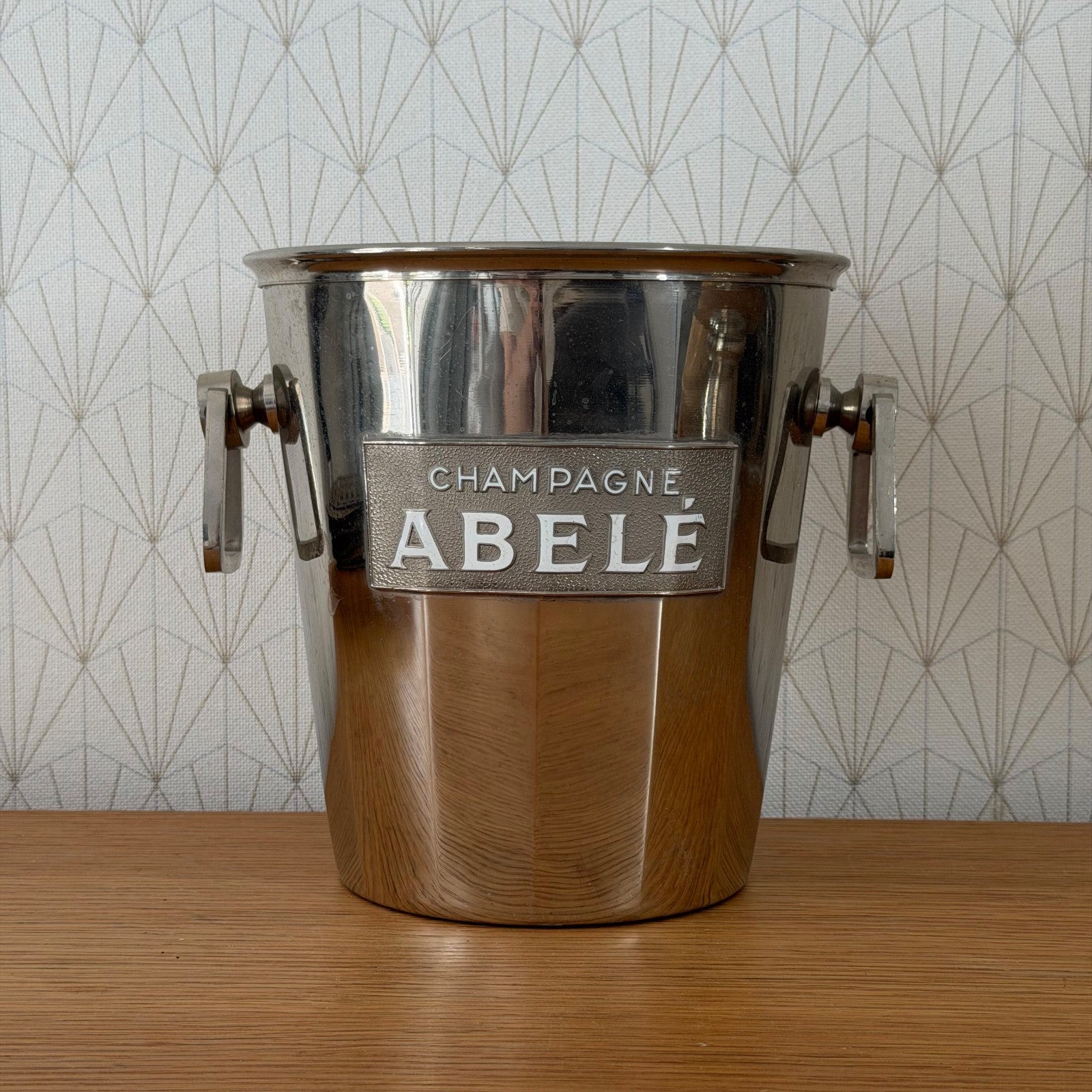 Front angle of vintage ABELE French wine bucket, polished silverplate finish