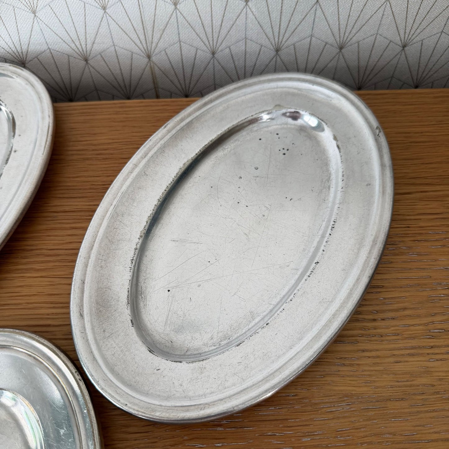 Complete set of five French Ercuis silver plated oval trays with classic stepped rim profile
