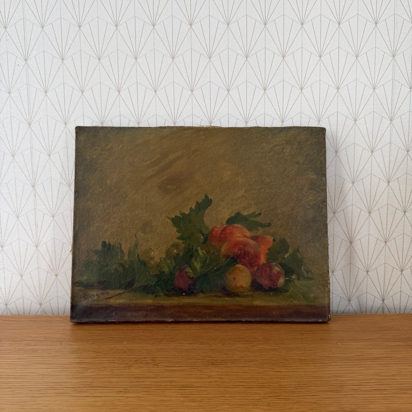 French antique still life oil painting with red peaches and green leaves on muted background