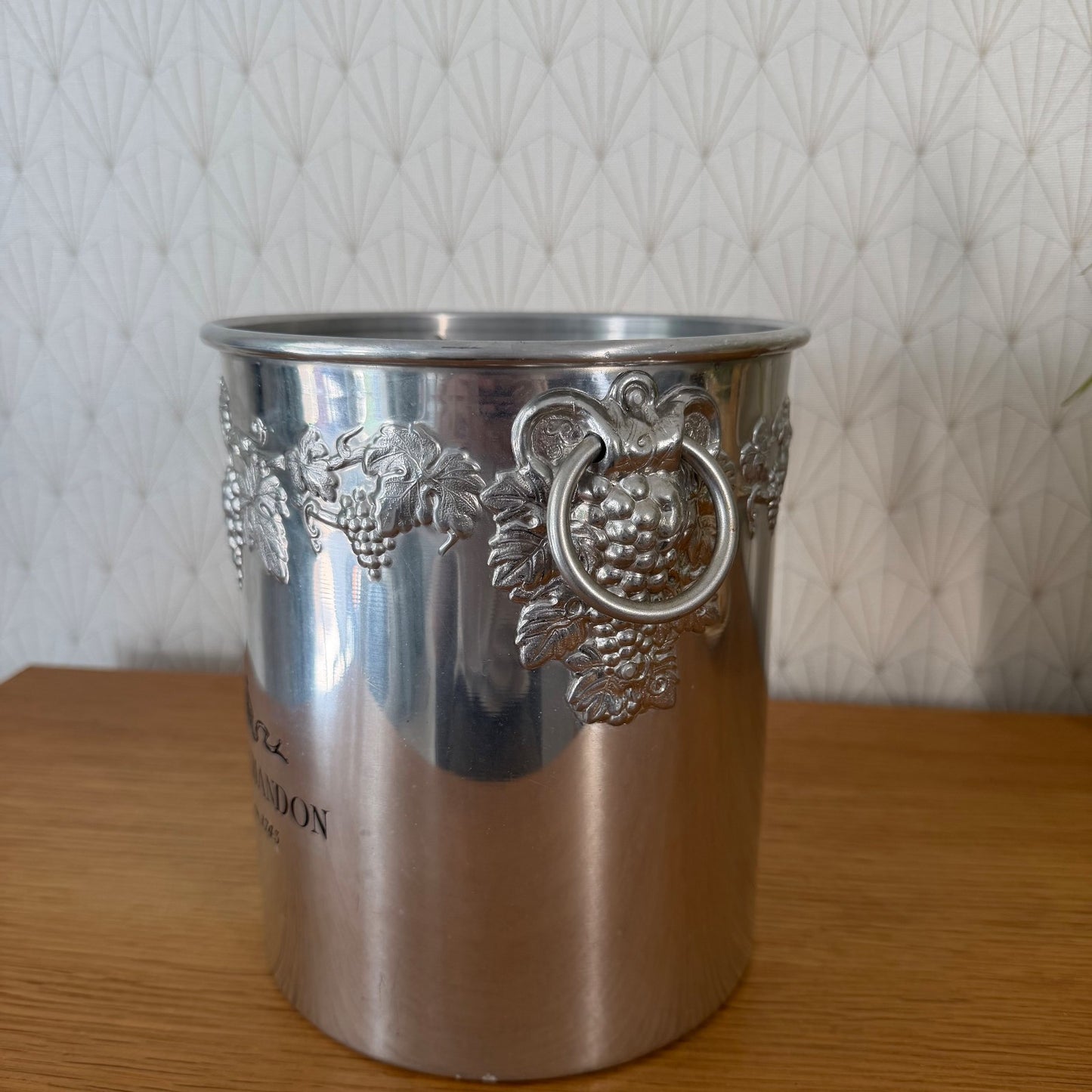 Interior view of Moet Chandon champagne cooler showing removable insert and grape vine motifs