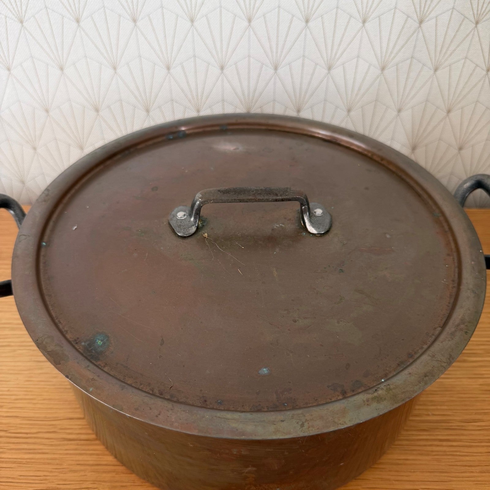 Close-up of Made in France stamp on copper cocotte body