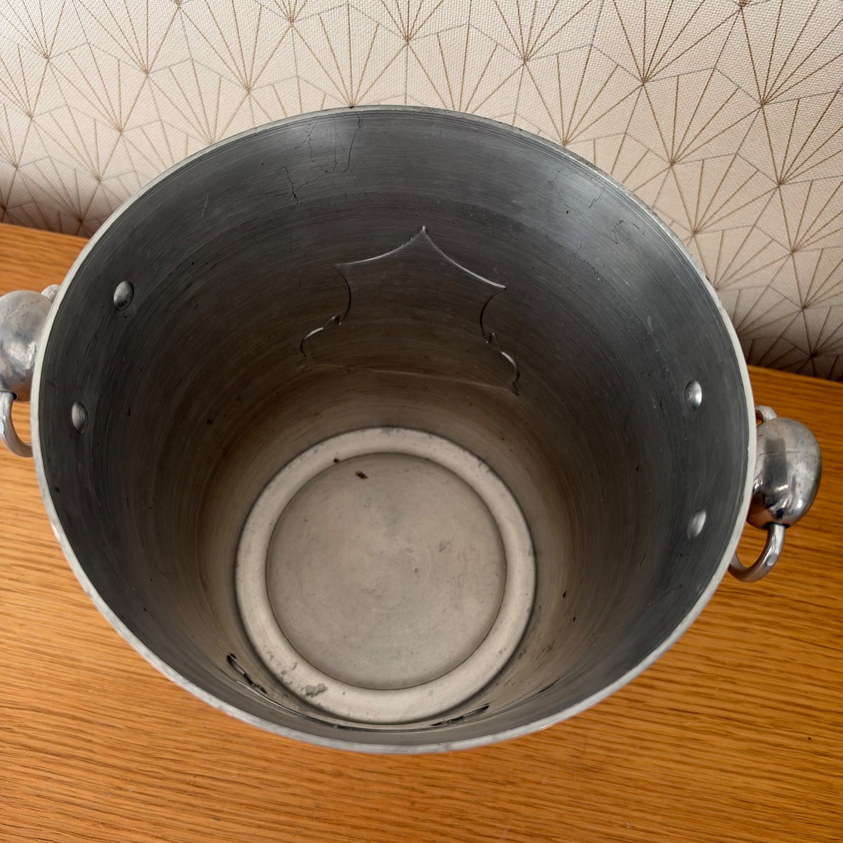 Interior view of aluminum champagne bucket showing polished finish and construction details
