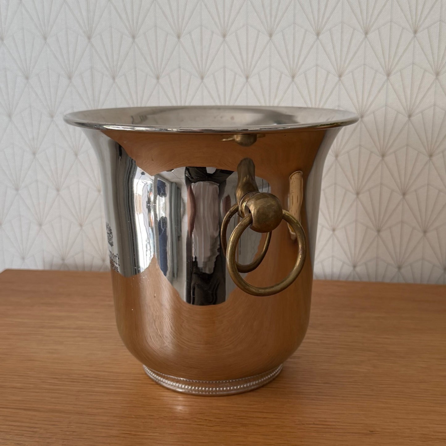 Side profile view of Ruinart ice bucket showing flared rim and tapered body