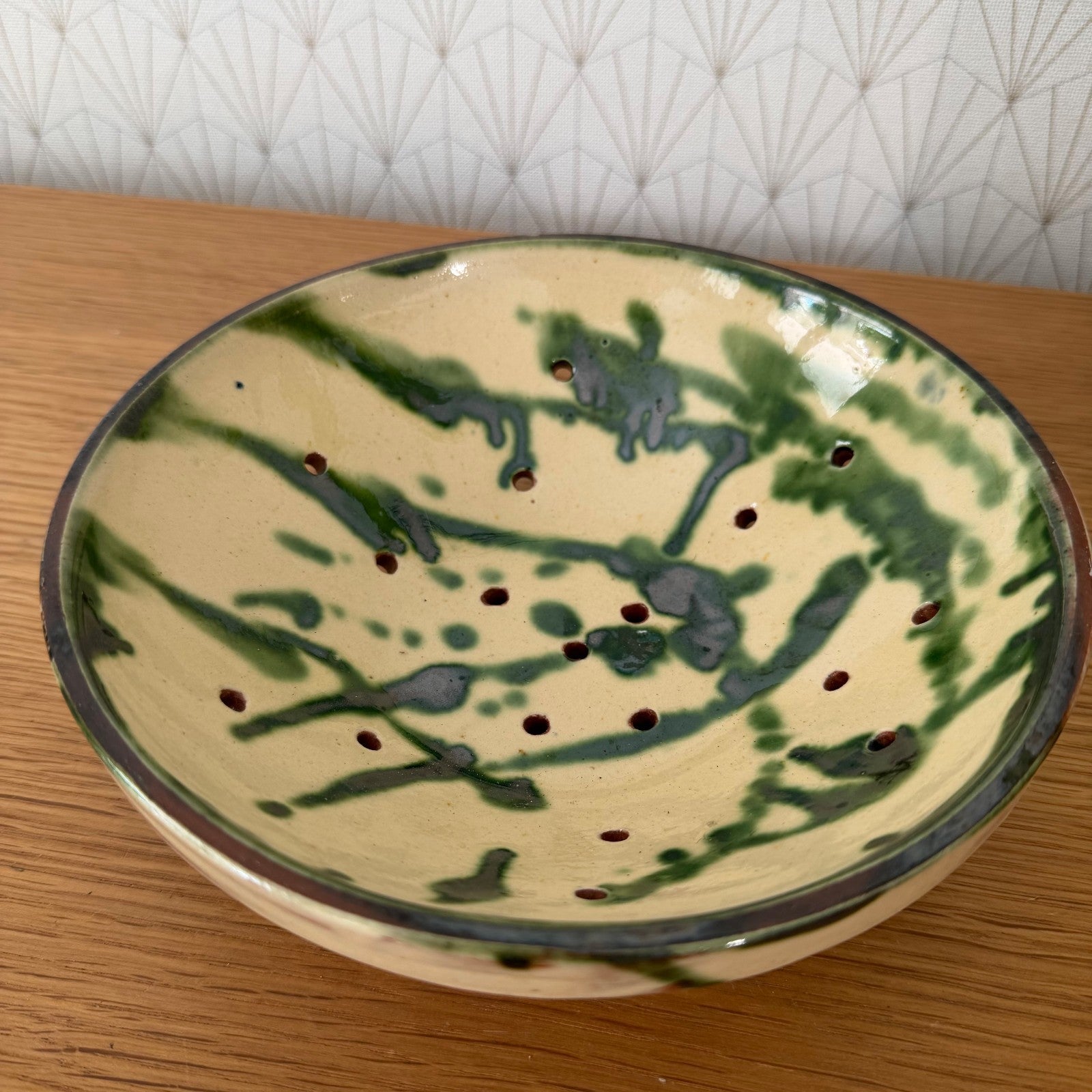 Hand-crafted French earthenware fruit drainer with contrasting two-tone glaze finish