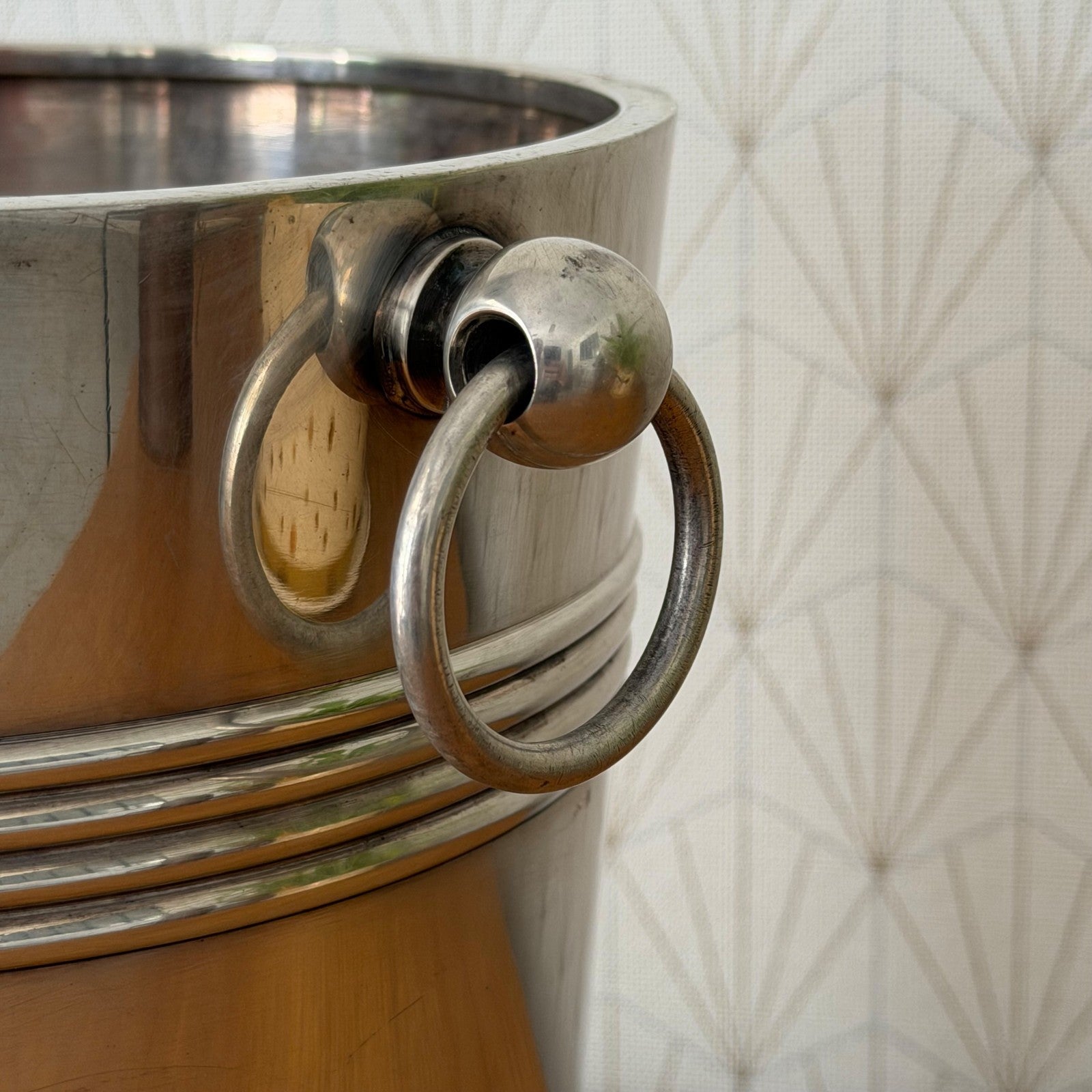 Detail of decorative ring handle and grooved band on Christofle champagne bucket