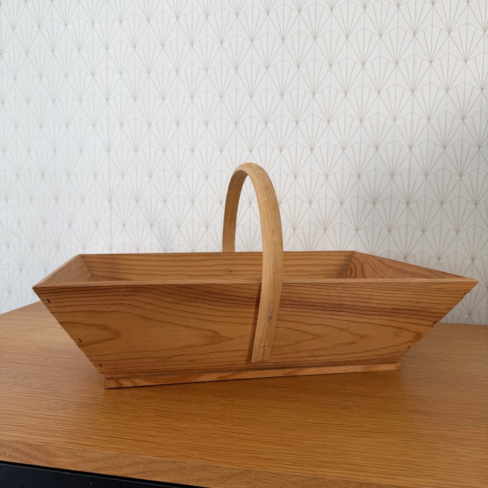 Side profile of vintage French wooden trug displaying natural wood patina and construction