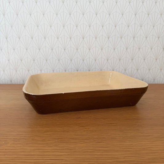 French brown stoneware gratin dish with rounded corners, side view