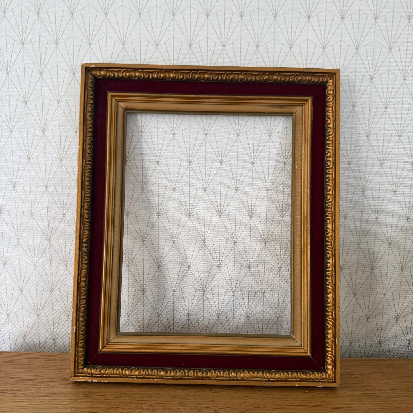 Close-up of French gold ornamental frame border detail with cast decorative molding