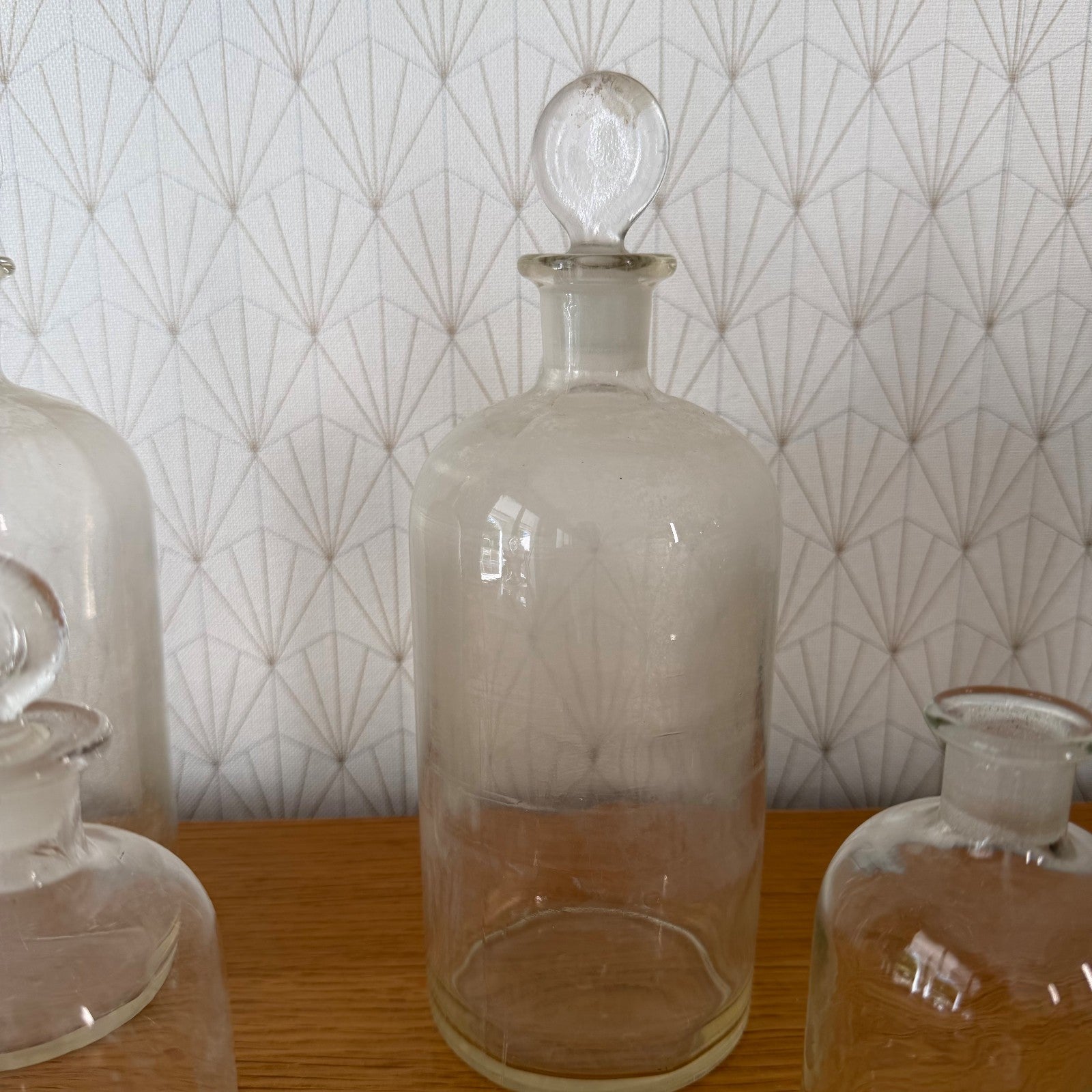 French apothecary glass bottle displaying original ball stopper and clear blown glass construction